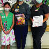 Summer Patterson (from left) donated coloring books to Kelly Diduch, RN, and Robin Davis, clinical manager for pediatrics, at UT Health Tyler. Summer created the coloring books as part of her Girl Scout Bronze Award service project. She got the idea for the coloring books from her own hospital stays as a child.