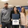 Abby, pictured with her parents Jason and
Jennifer Williams, displays her certificate.