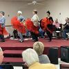 Can-can dancers rehearse with the East Texas Pioneer String Band.